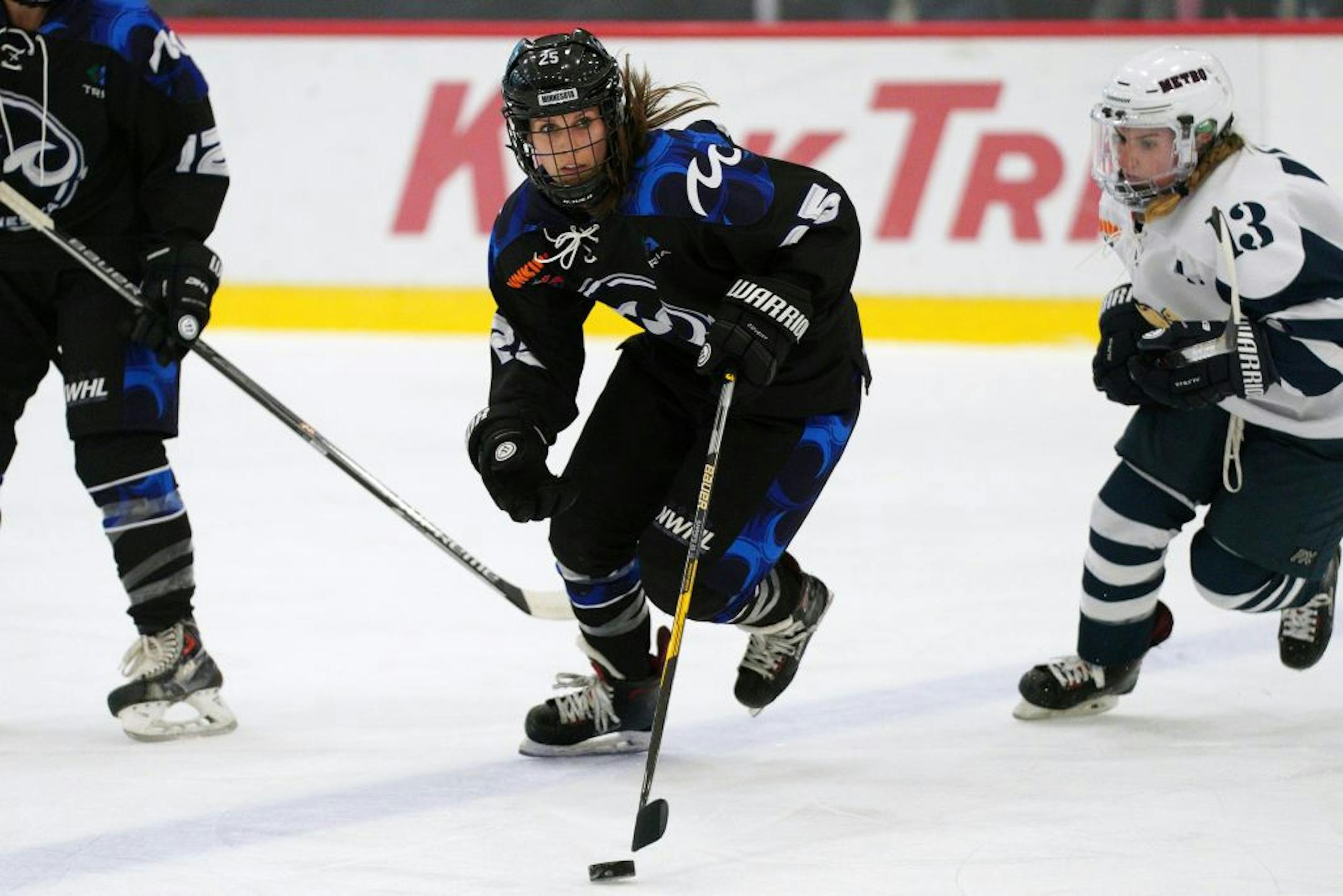 Whitecaps forward Lauren Barnes (25) skated with the puck during Saturday's game.