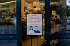 A sign that mentions required facemasks at the Randalls grocery store where Elaine Roberts works in Bellaire, Texas, July 16, 2020. In Texas, the chai