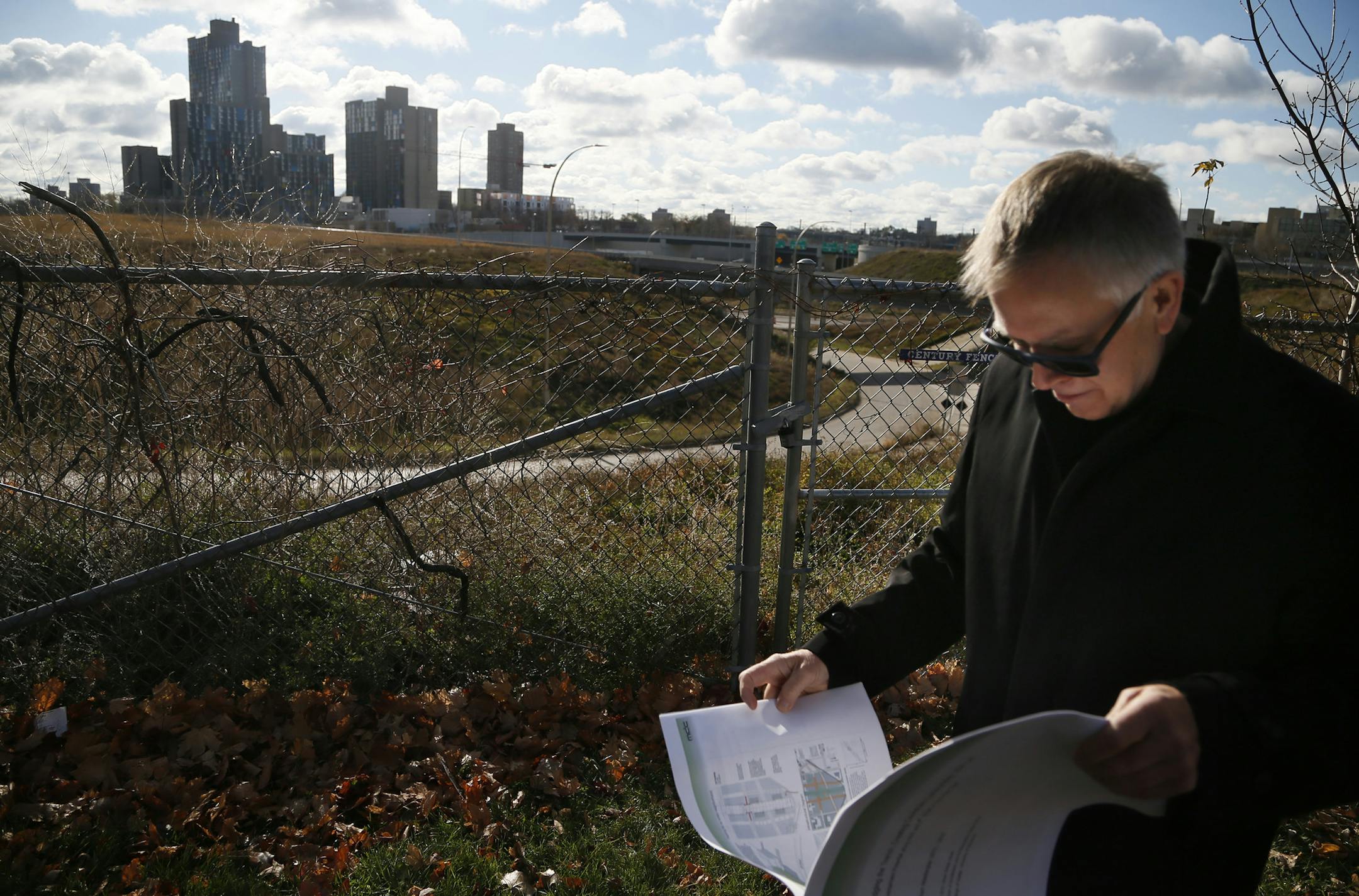 Mic Johnson stood near the proposed site at I-35W near Washington Avenue Thursday November 6 , 2014 in Minneapolis ,MN. A coalition of leaders want to put a lid over I-35W to connect Cedar-Riverside to downtown Minneapolis. Johnson is design principal at Architecture Field Office. ] Jerry Holt Jerry.holt@startribune.com