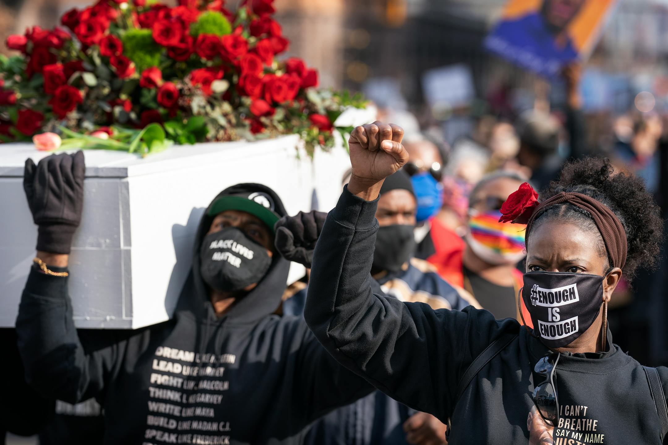 Raj Sethuraju, left, and Selena McKnight marched in a rally to mourn the murder of George Floyd.
