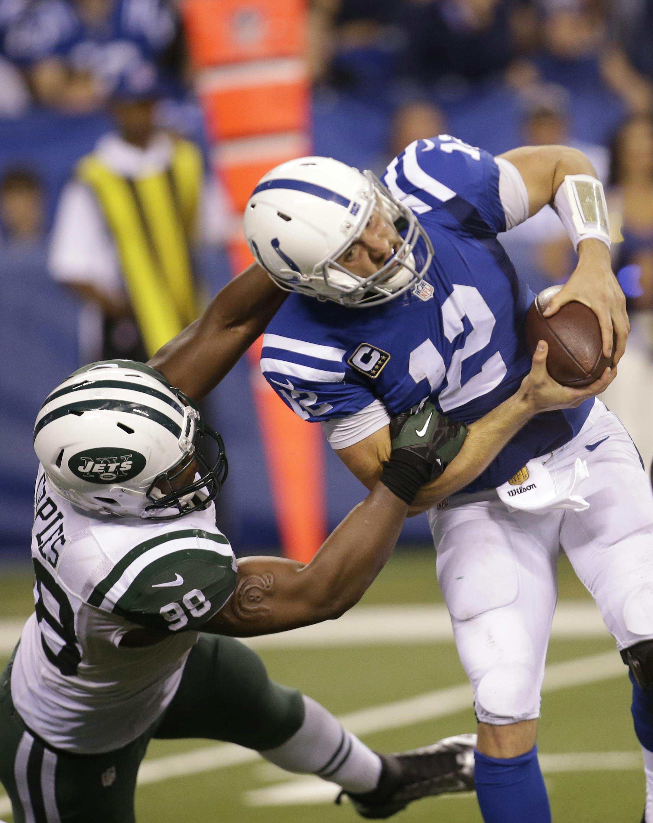New York Jets outside linebacker Quinton Coples (98) sacks Indianapolis Colts quarterback Andrew Luck (12) in the second half of an NFL football game in Indianapolis, Monday, Sept. 21, 2015. (AP Photo/AJ Mast)