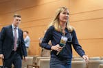 Sen. Nicole Mitchell, DFL-Woodbury, leaves her Senate ethics committee hearing at the State Capitol with attorney Dane DeKrey on June 12 after the com