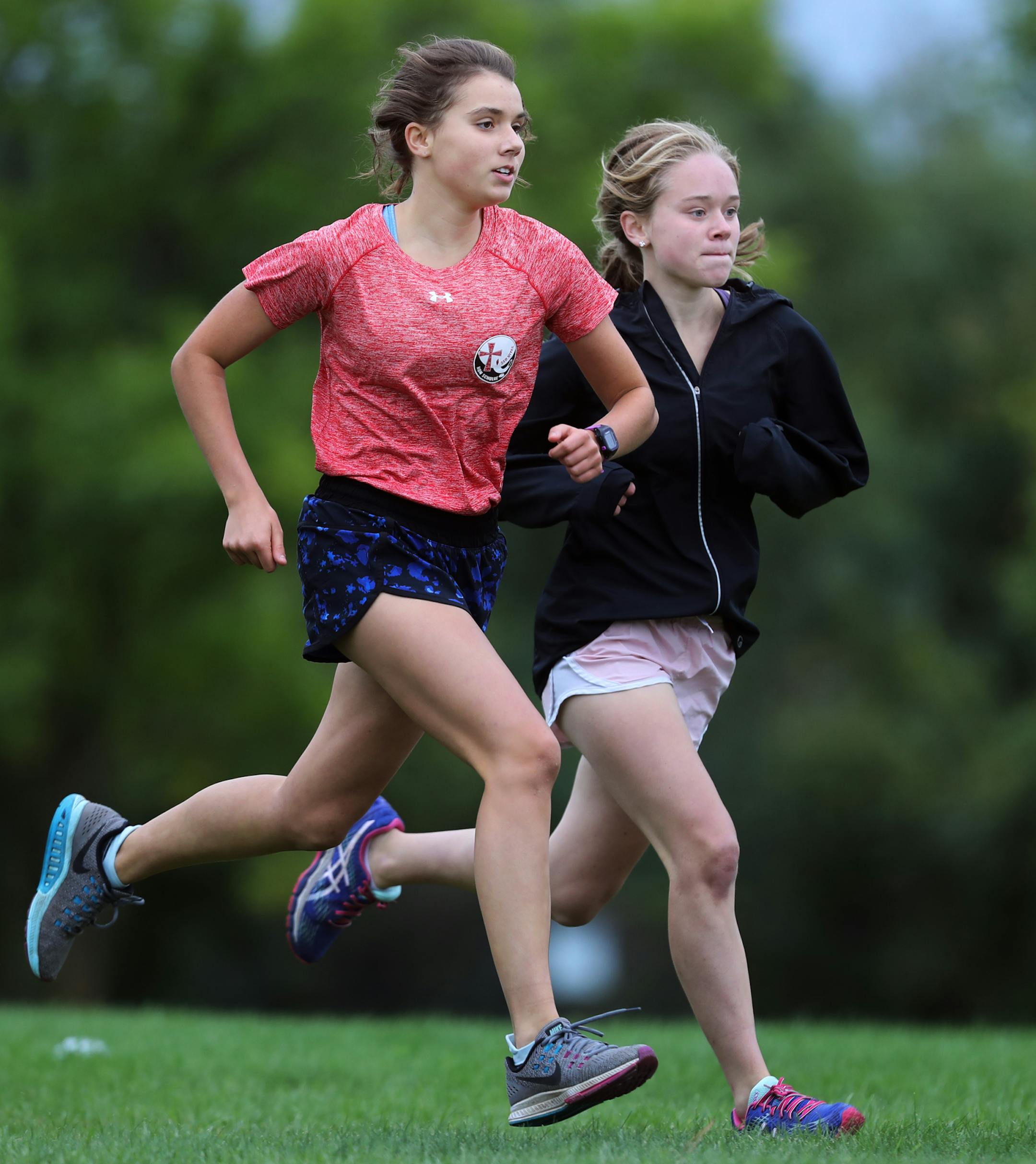 Left to right: Nina Reamer and Ellie McConville did their interval training.] The girls' cross country team at Visitation is making waves this season.Richard Tsong-Taatarii/rtsong-taatarii@startribune.com