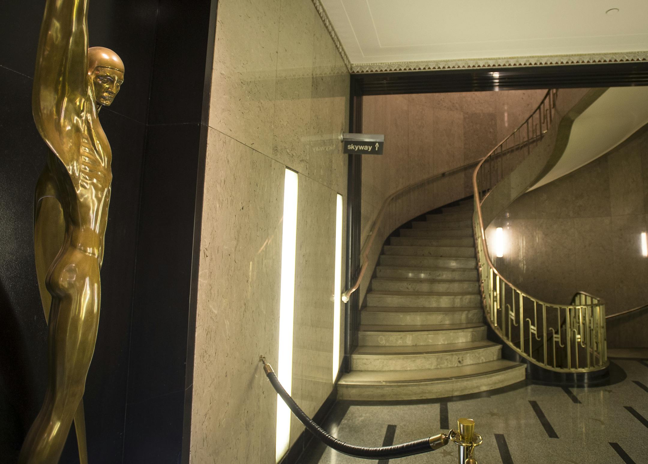 The Rand Tower's compact lobby, with its gracefully curved staircases and inlaid terrazzo floor, is considered a Deco gem.