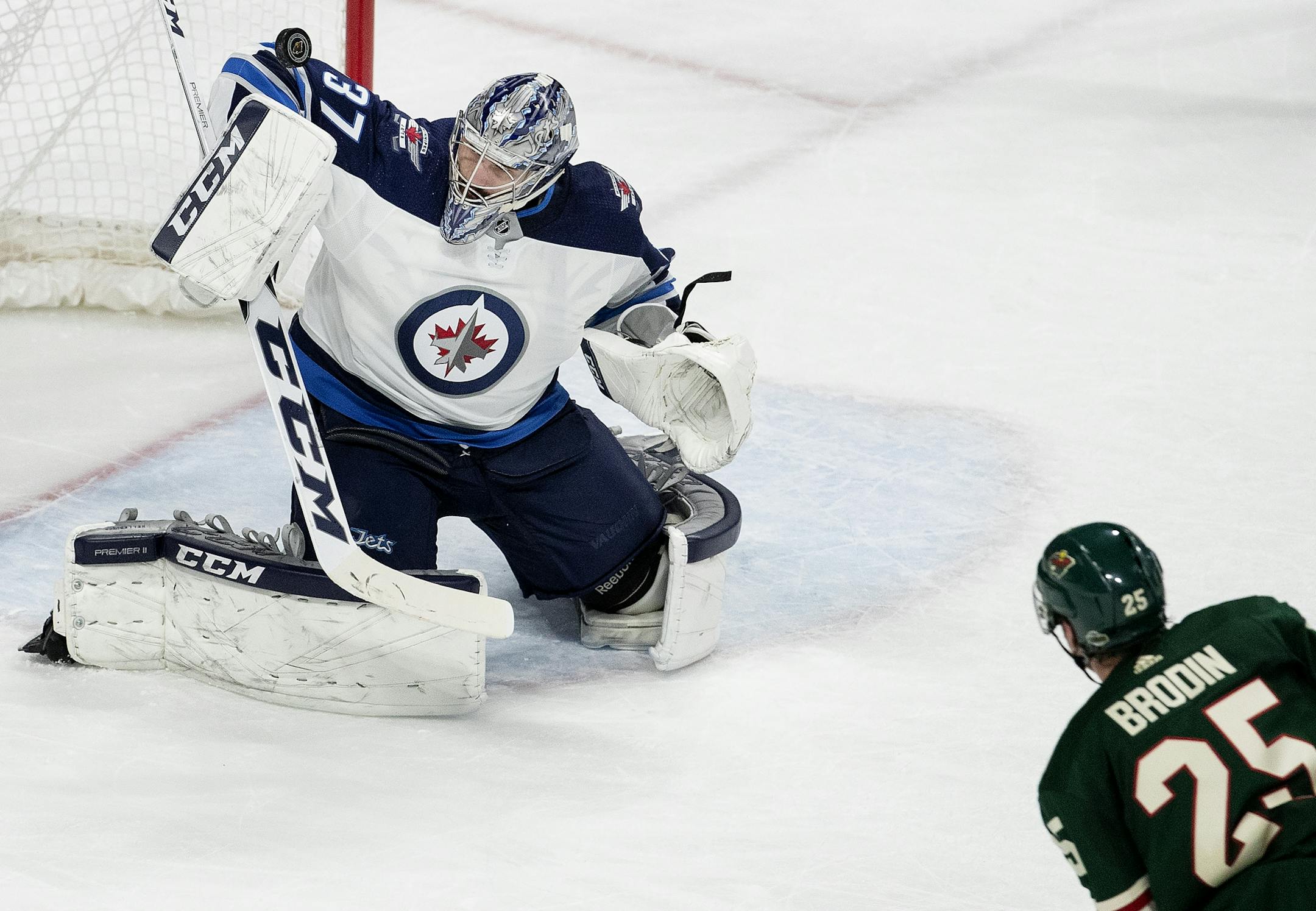 Goalie Connor Hellebuyck (37) made a save in the second period.