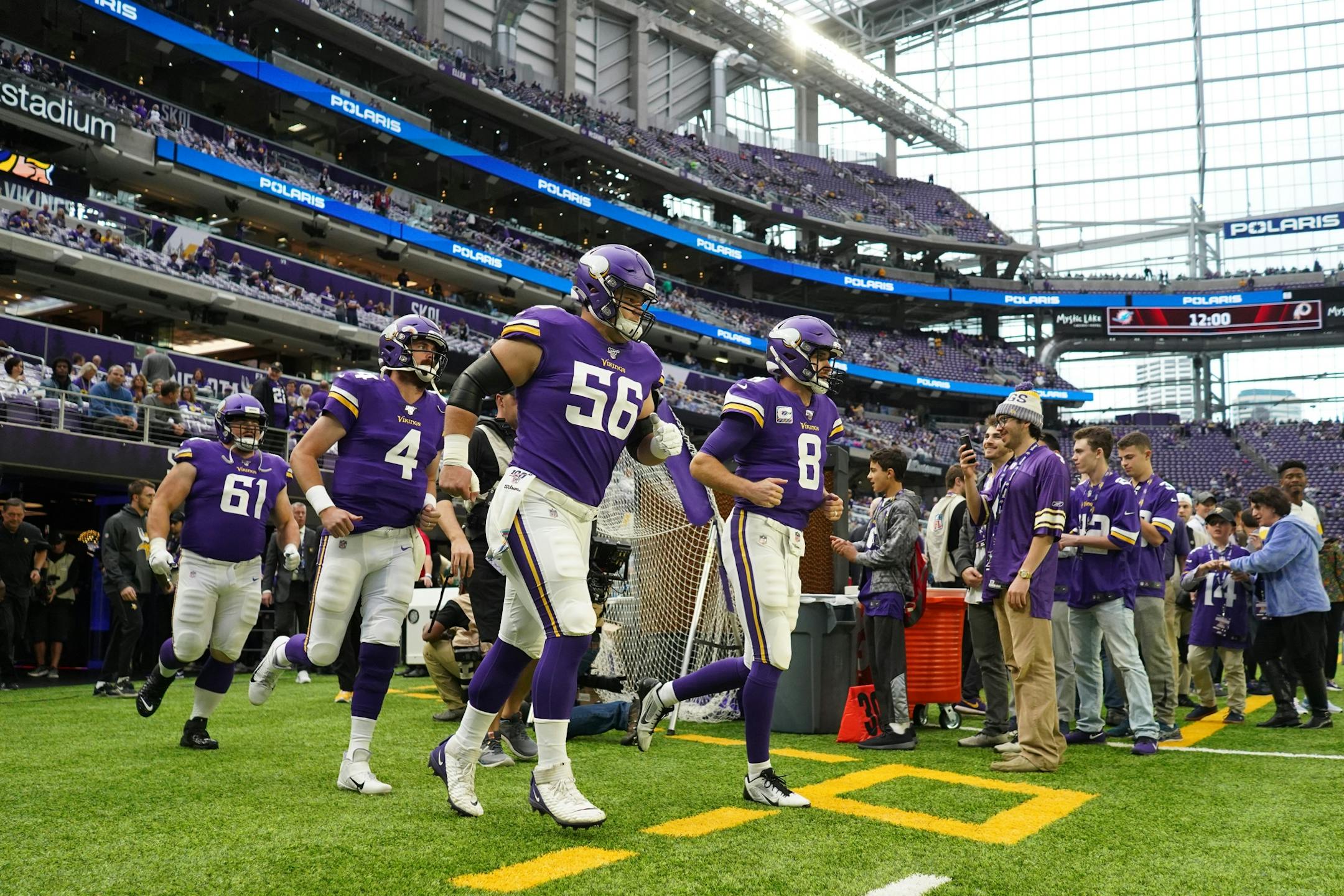 Minnesota Vikings quarterback Kirk Cousins (8) led his team out on to the field for warmups ahead of Sunday's game against the Philadelphia Eagles.