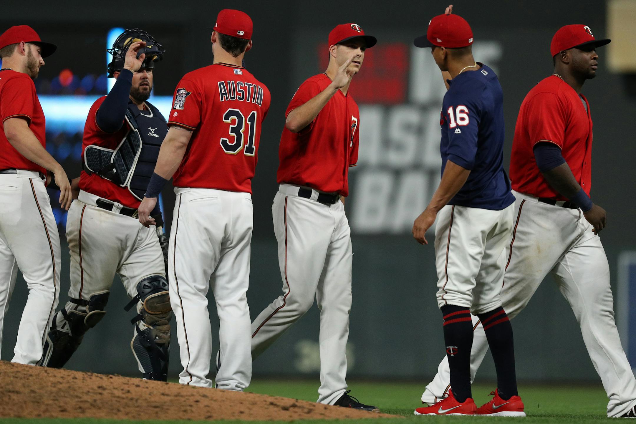 Minnesota Twins relief pitcher Taylor Rogers (55) celebrated with his teammates after the win. ] ANTHONY SOUFFLE ï anthony.souffle@startribune.com The Minnesota Twins played the Detroit Tigers in an MLB game Friday, Aug. 17, 2018 at Target Field in Minneapolis.