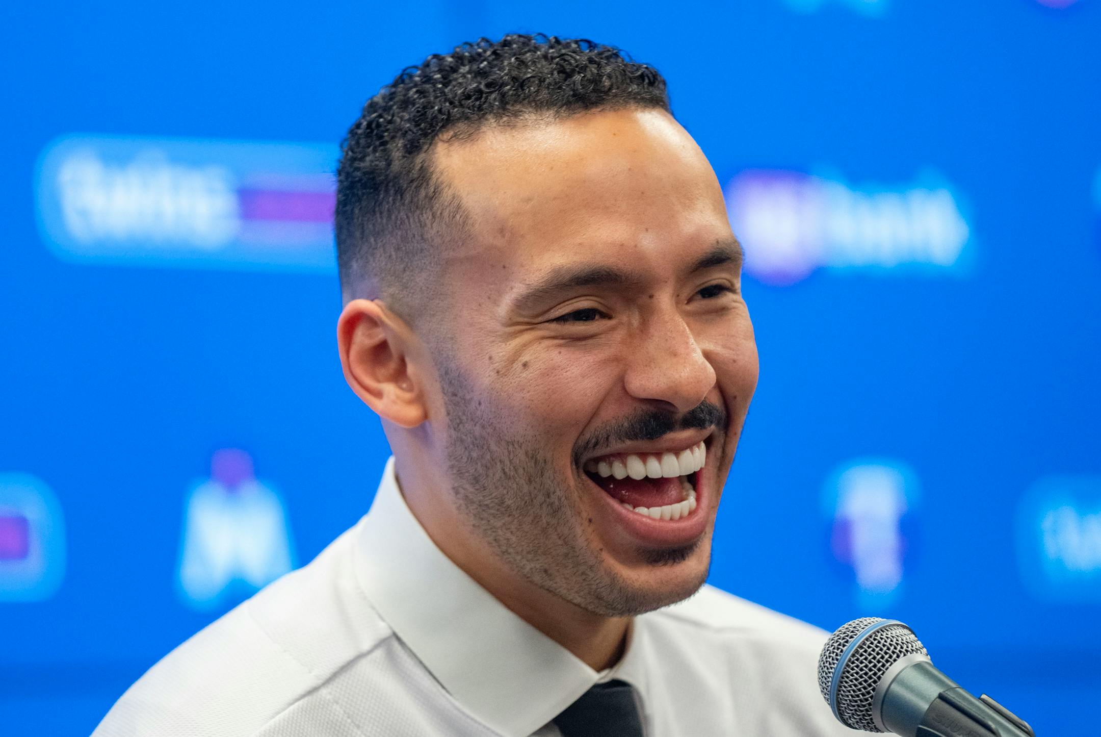 Minnesota Twins shortstop Carlos Correa smiles during a press conference.