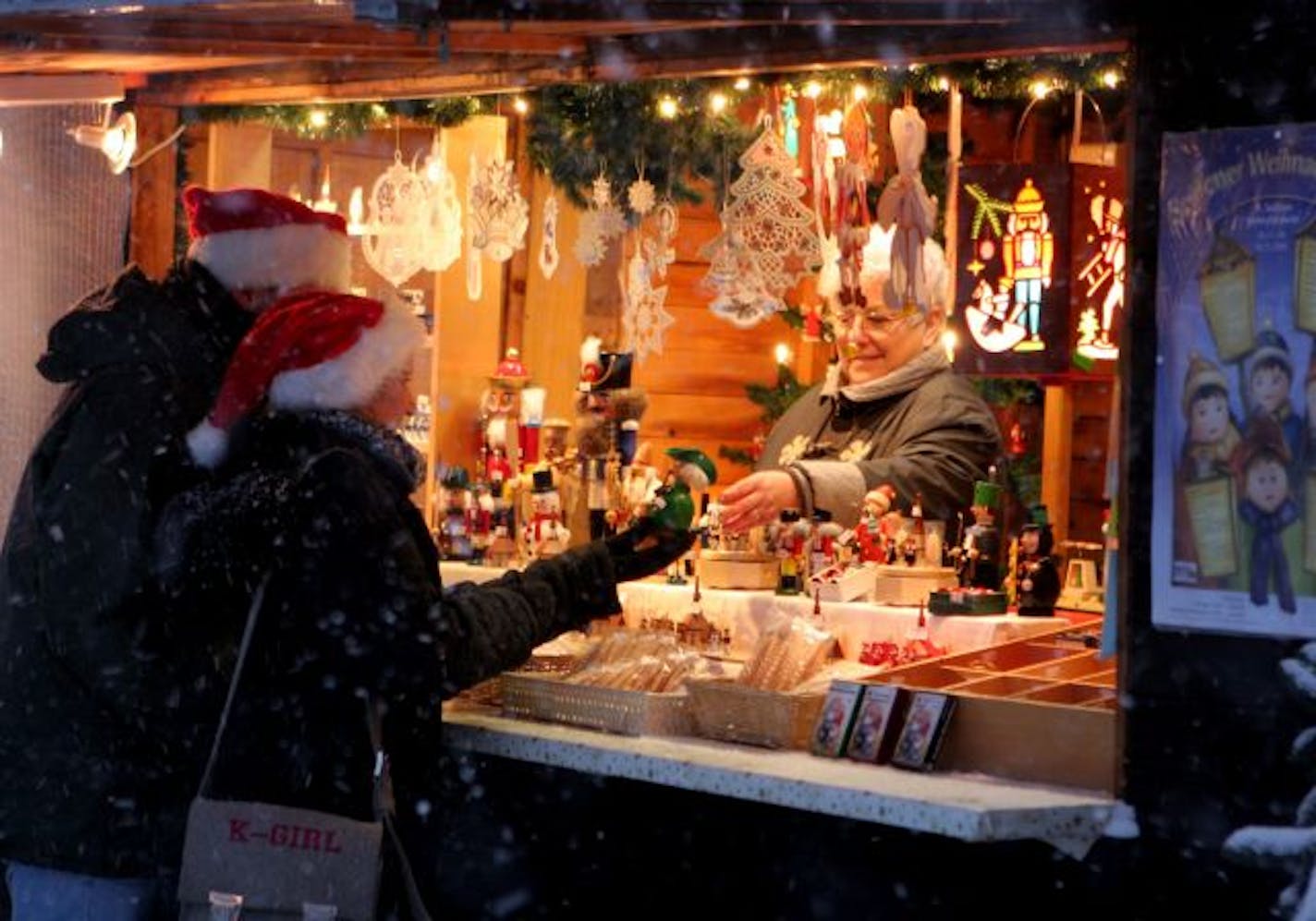 A vendor sells crafts at the Seiffen Christmas Market.