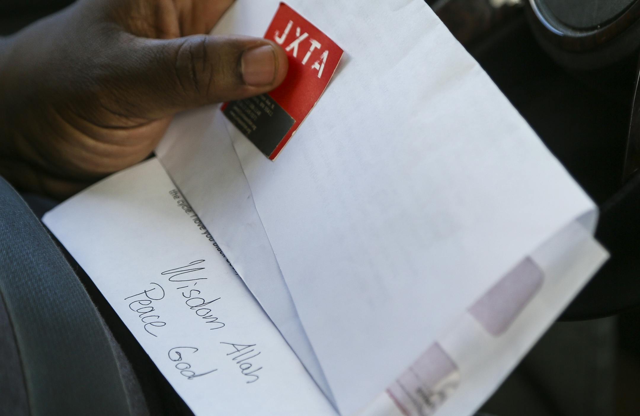 Ferome Brown reads a letter written by student Caliph Conner. Conner, who also spent time incarcerated, was not able to apply for the mentorship program, he still regularly attends meetings as a way to learn new ways to positively affect people around him.