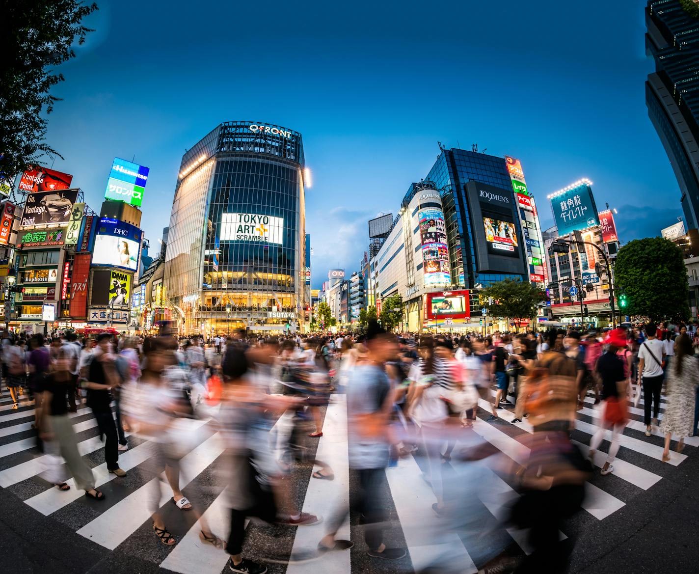 Fisheye view of crowds of people at the famous Shibuya Crossing.