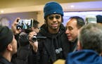 D'Angelo Russell, the newest Timberwolves player, arrived at the Signature wing of MSP airport. He was greeted by Timberwolves President Gersson Rosas