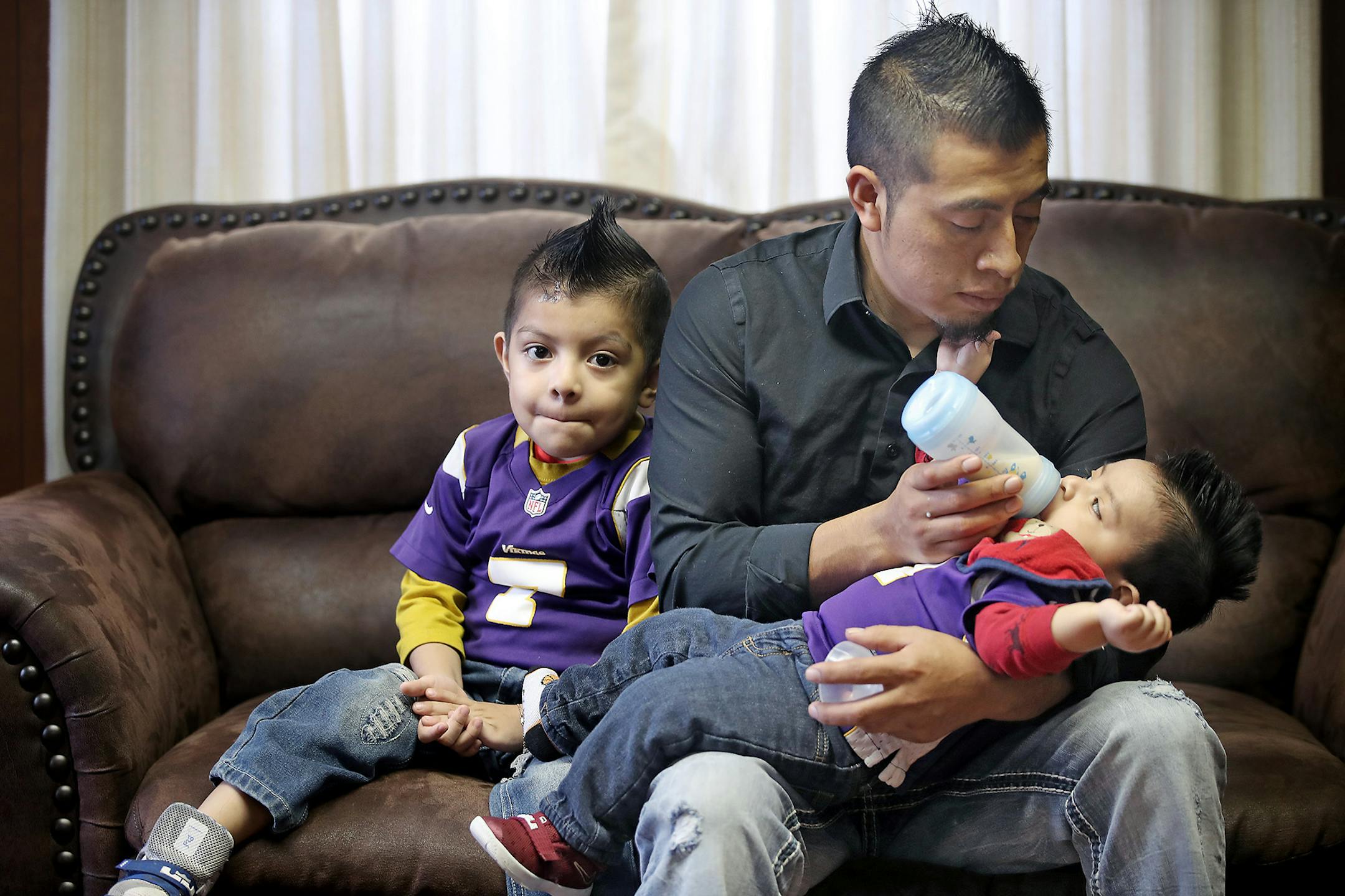 St. Mary's Catholic Church member Eligio Ramirez took care of his two sons as he shared what he helps do with the Worthington Latino community Thursday, February 23, 2017 in Worthington, MN. Ramirez helps people who have newly arrived to Worthington and he helps with the domestic abuse ministry at the church.