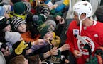 Minnesota Wild left wing Jordan Greenway (18) signed autographs following the Wild's outdoor practice Thursday. ] ANTHONY SOUFFLE &#x2022; anthony.sou