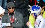 Tiger Woods, left, watches United States' Lindsey Vonn, right, during the women�s giant slalom competition at the alpine skiing world championships 