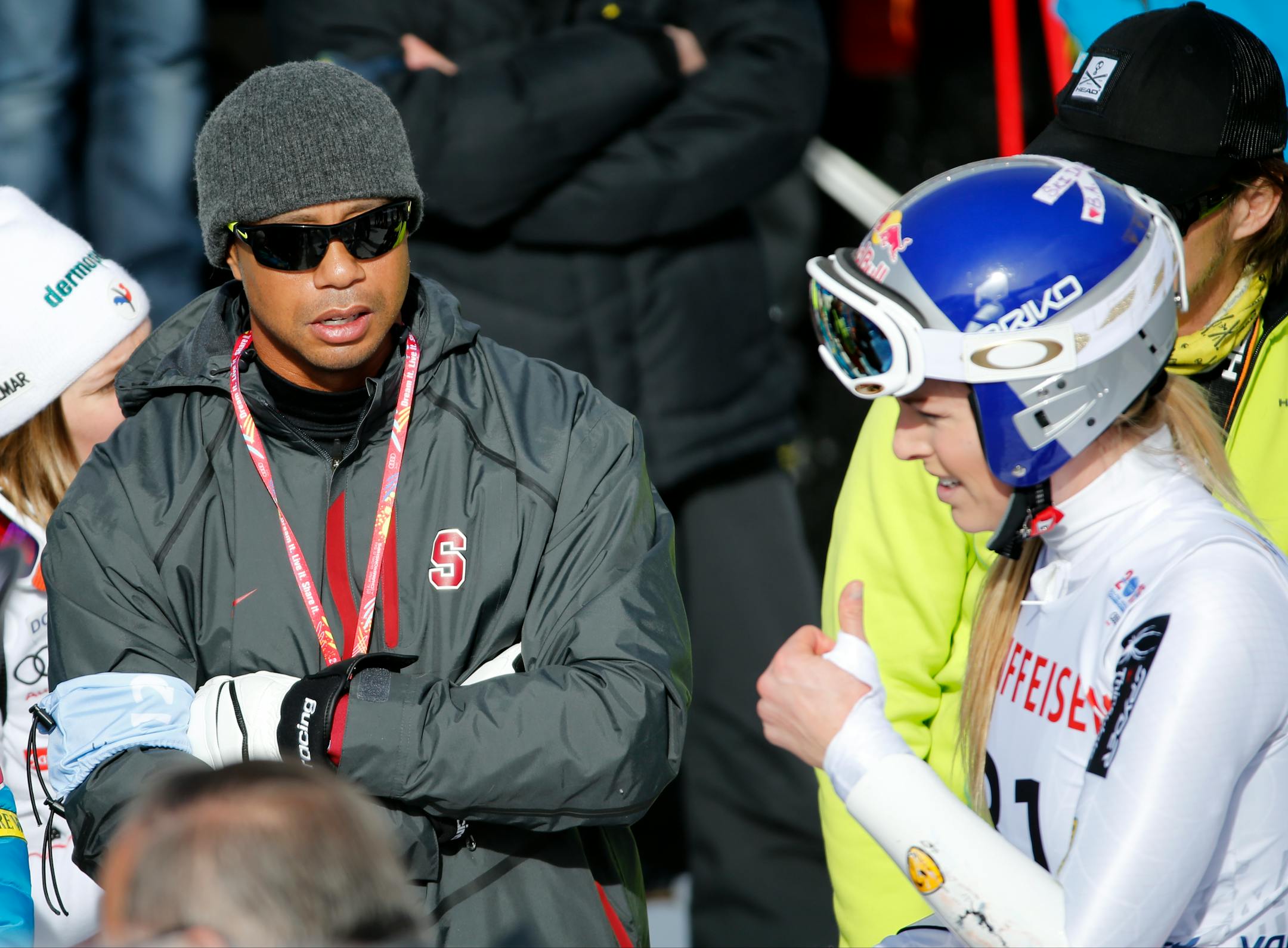 Tiger Woods, left, watches United States' Lindsey Vonn, right, during the women�s giant slalom competition at the alpine skiing world championships on Thursday, Feb. 12, 2015, in Beaver Creek, Colo. (AP Photo/Marco Trovati)