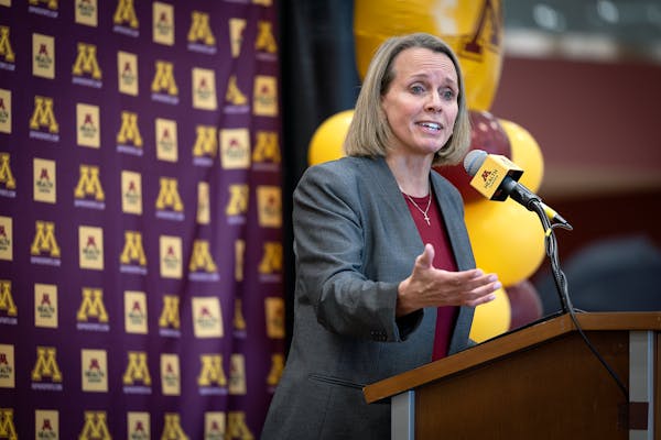 Dawn Plitzuweit, the University of Minnesota's new women's basketball coach, addresses the media during a press conference.
