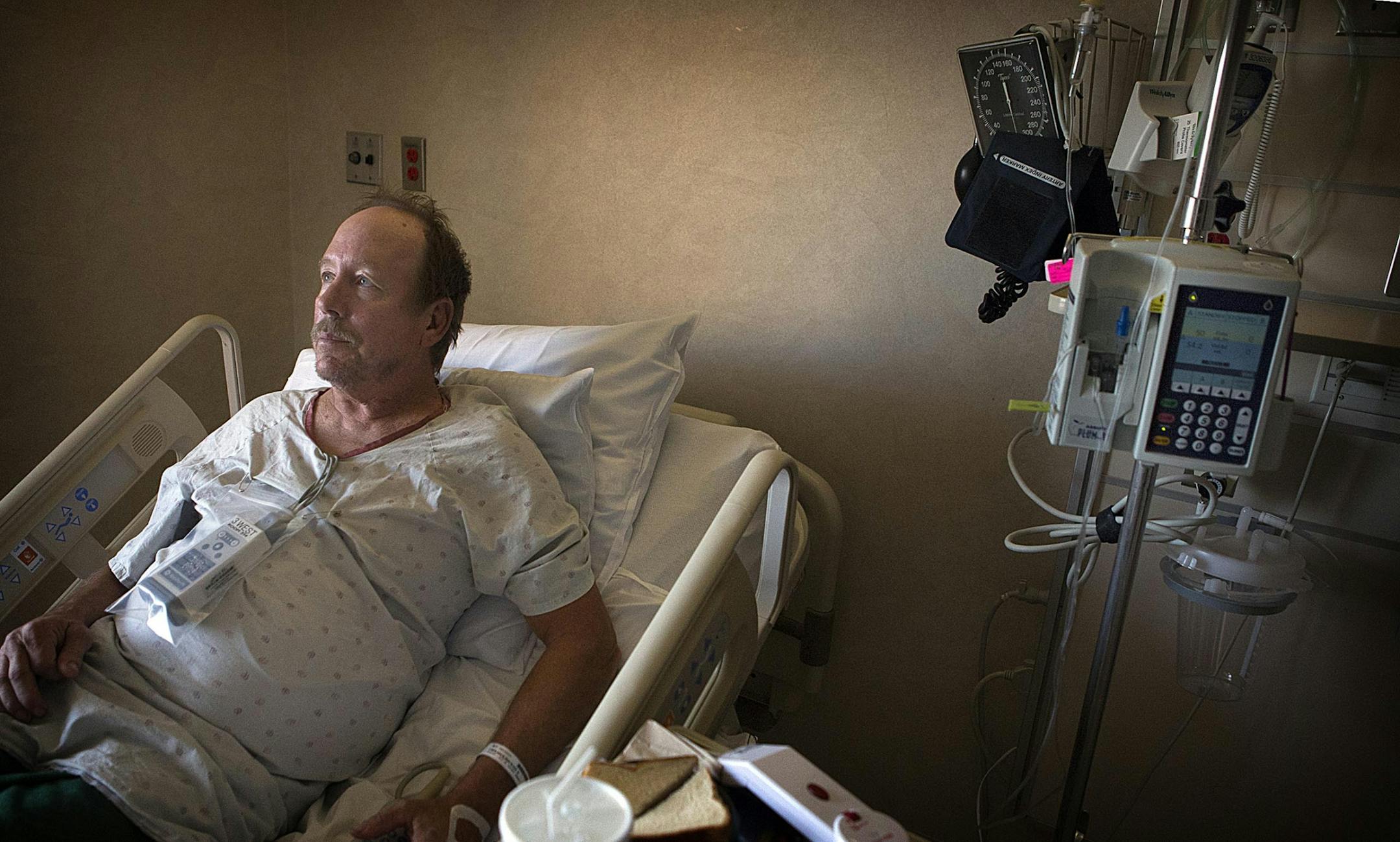 Mike Coolidge stopped when he saw an early morning fire and pulled an unconscious woman from her burning house Tuesday. Coolidge was treated for smoke inhalation at Mercy Hospital, where doctors also monitored his heart.