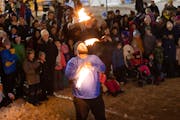 A fire show is among the events at the World Snow Sculpting Championship in Stillwater on Saturday.