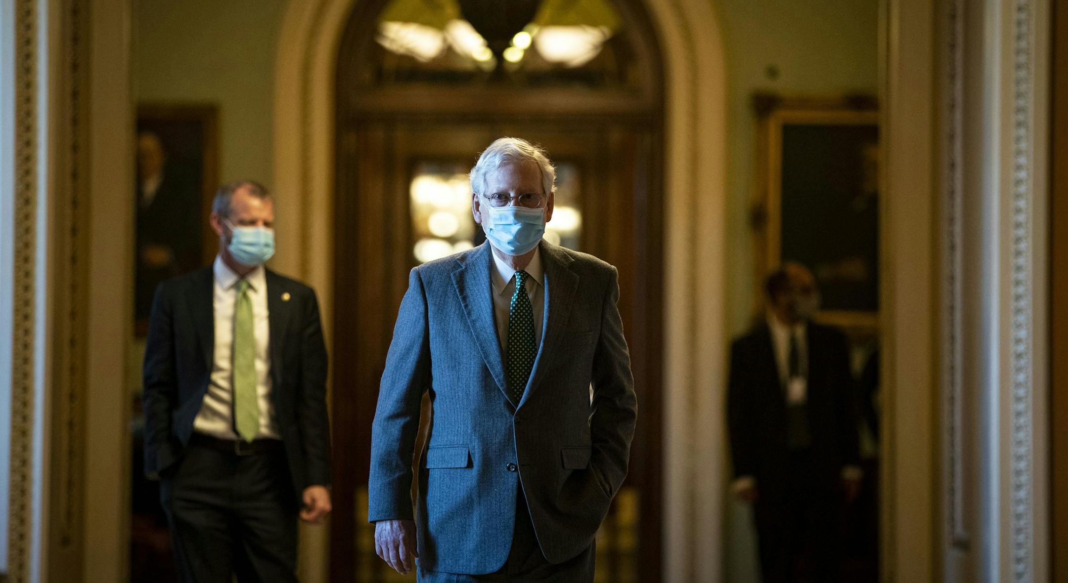 Senate Majority Leader Mitch McConnell, R-Ky., walks to his office from the Senate floor of the Capitol on Dec. 3.