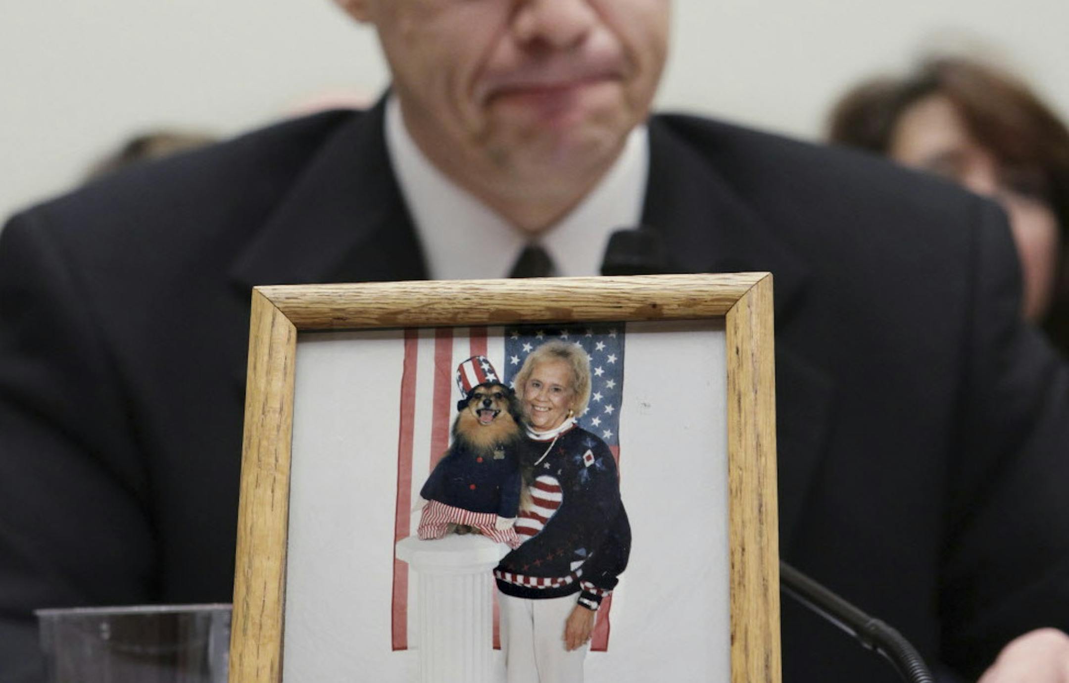 Jeff Almer of Savage, Minn., testifies on Capitol Hill in Washington, Wednesday, Feb. 11, 2009, before the House Energy and Commerce subcommittee on Oversight and Investigations hearing to examine the recent salmonella outbreak associated with peanut products. His mother, mother, 72-year-old Shirley Mae Almer, shown in a family photo, died after eating tainted peanut butter at a Brainerd, Minn., assisted-living home. (AP Photo/J. Scott Applewhite)