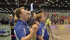 Brothers Ryan and Robert Hlucny of the Greenbush Middle River robotics team cheer their score during competition at the world championship.