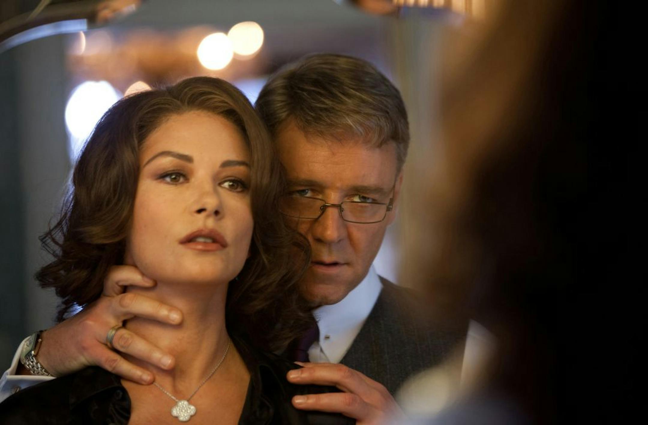 The Mayor (Russell Crowe, right) subtly threatens his wife, the city's first lady (Catherine Zeta-Jones), whom he suspects might be undermining his plans in "Broken City."