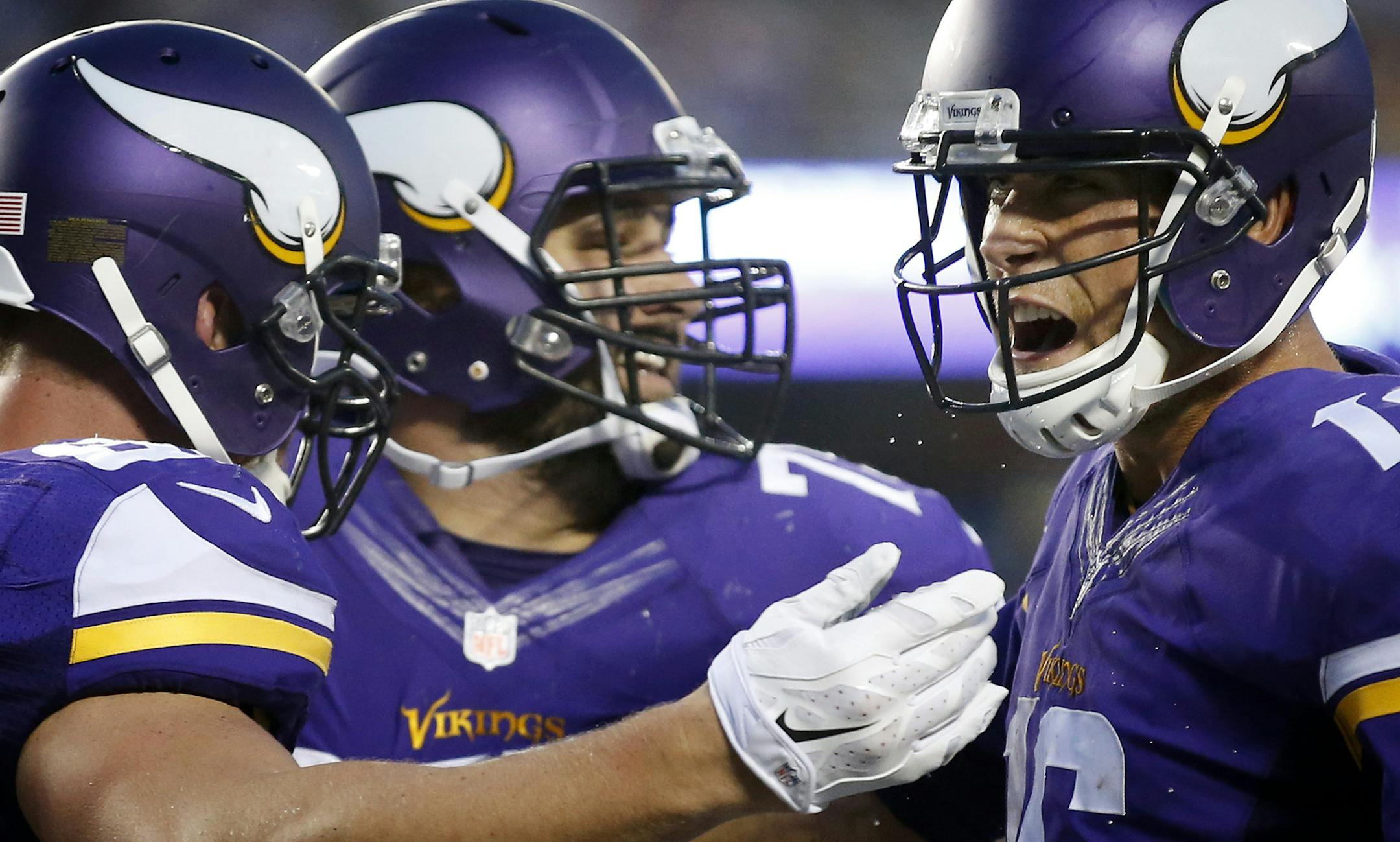 Kyle Rudolph (82) Matt Kalil (75) and Matt Cassel (16) celebrated after a 51- yard catch and run touchdown in the second quarter. ] CARLOS GONZALEZ cgonzalez@startribune.com - August 16, 2014 , Minneapolis, Minn., NFL, TCF Bank Stadium, Minnesota Vikings vs. Arizona Cardinals