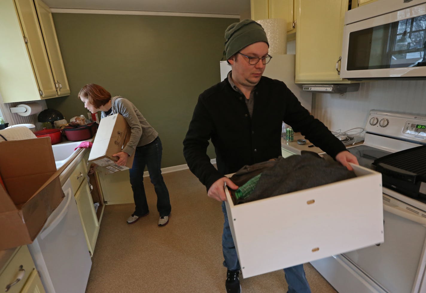 Karen and Mark Swoverland packed up items in the kitchen as they moved to an apartment after selling their house in south Minneapolis.