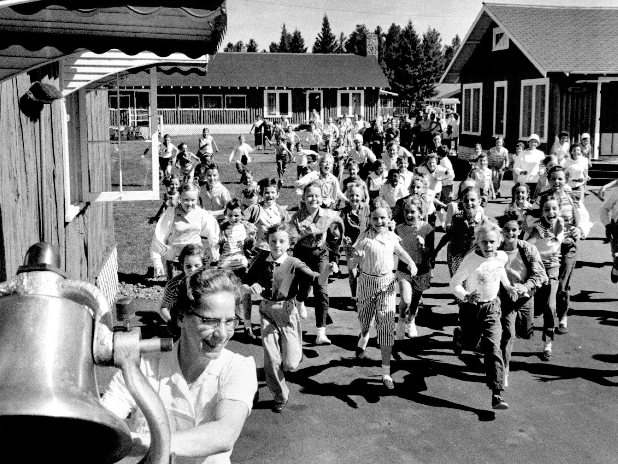 August 31, 1958 Dainty little bundles of sugar and spice dash madly for the food when the old chow bell clangs out. Minneapolis Sunday Tribune ORG XMIT: MIN2015091213393402