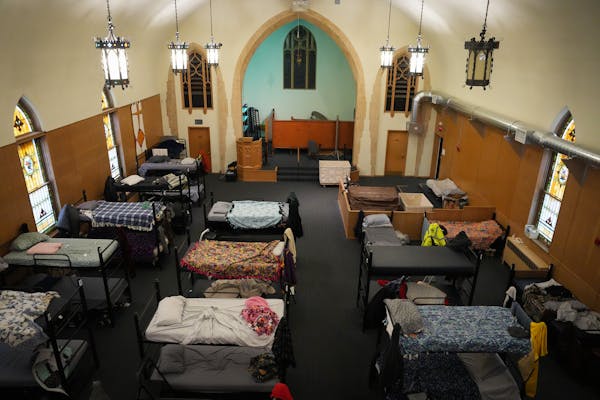 Bunk beds replace pews inside the former Zion Lutheran Church now utilized by Simpson Housing Services as a temporary homeless shelter in Minneapolis,