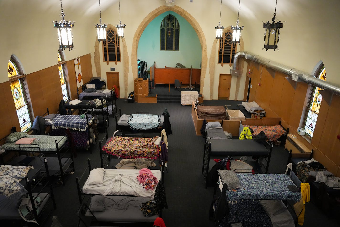 Bunk beds replace pews inside the former Zion Lutheran Church now utilized by Simpson Housing Services as a temporary homeless shelter in Minneapolis, Minn., on Tuesday, April 4, 2023. ] SHARI L. GROSS • shari.gross@startribune.com