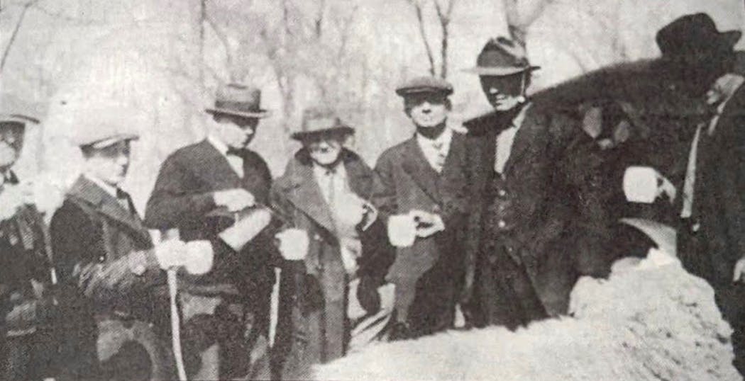 Men in Stearns County's Holdingford, known as a hotspot of moonshining during Prohibition, socialized with alcohol.