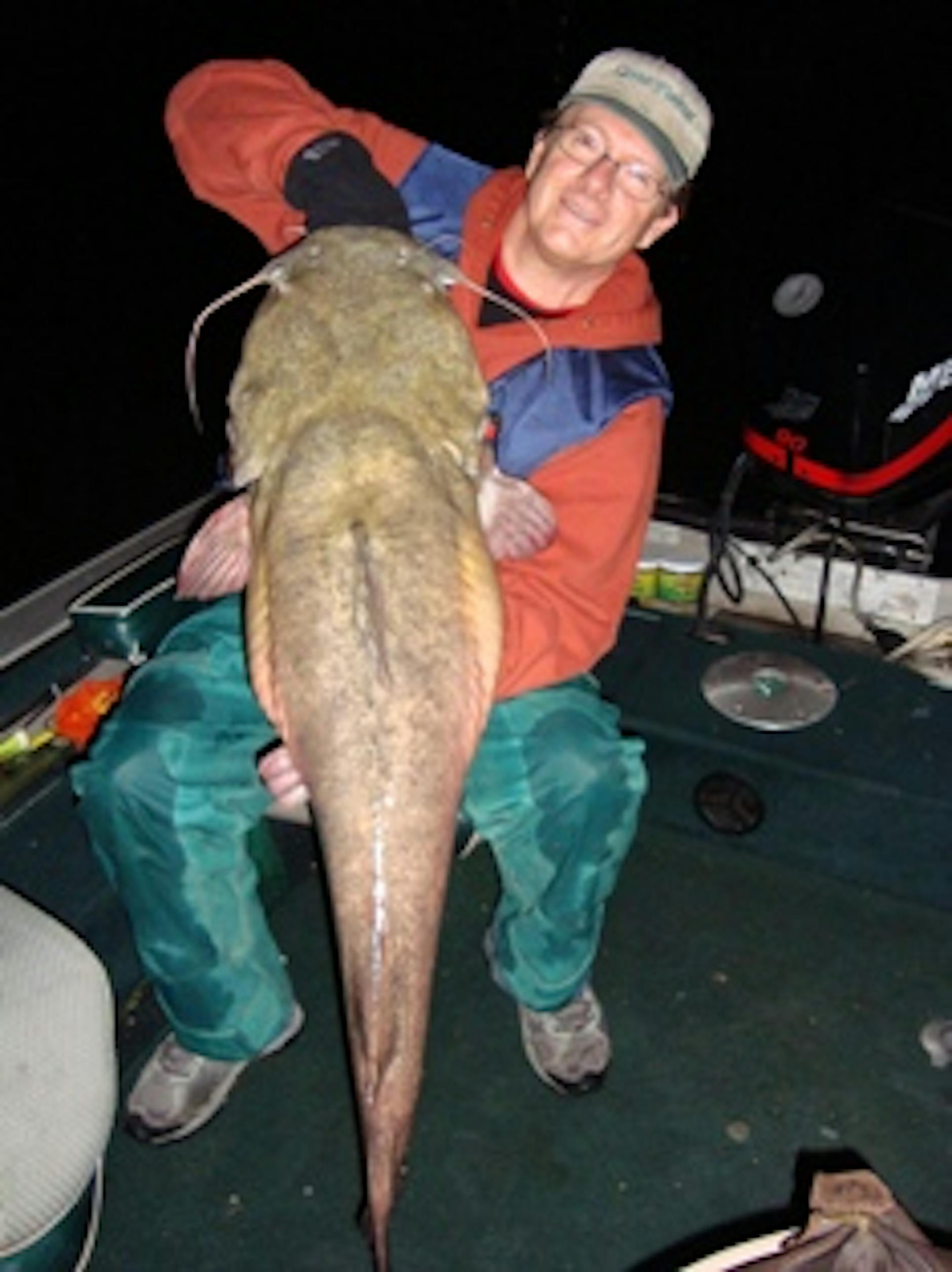 Robert Pellan of Calgary Canada with his 42 lbs Flathead