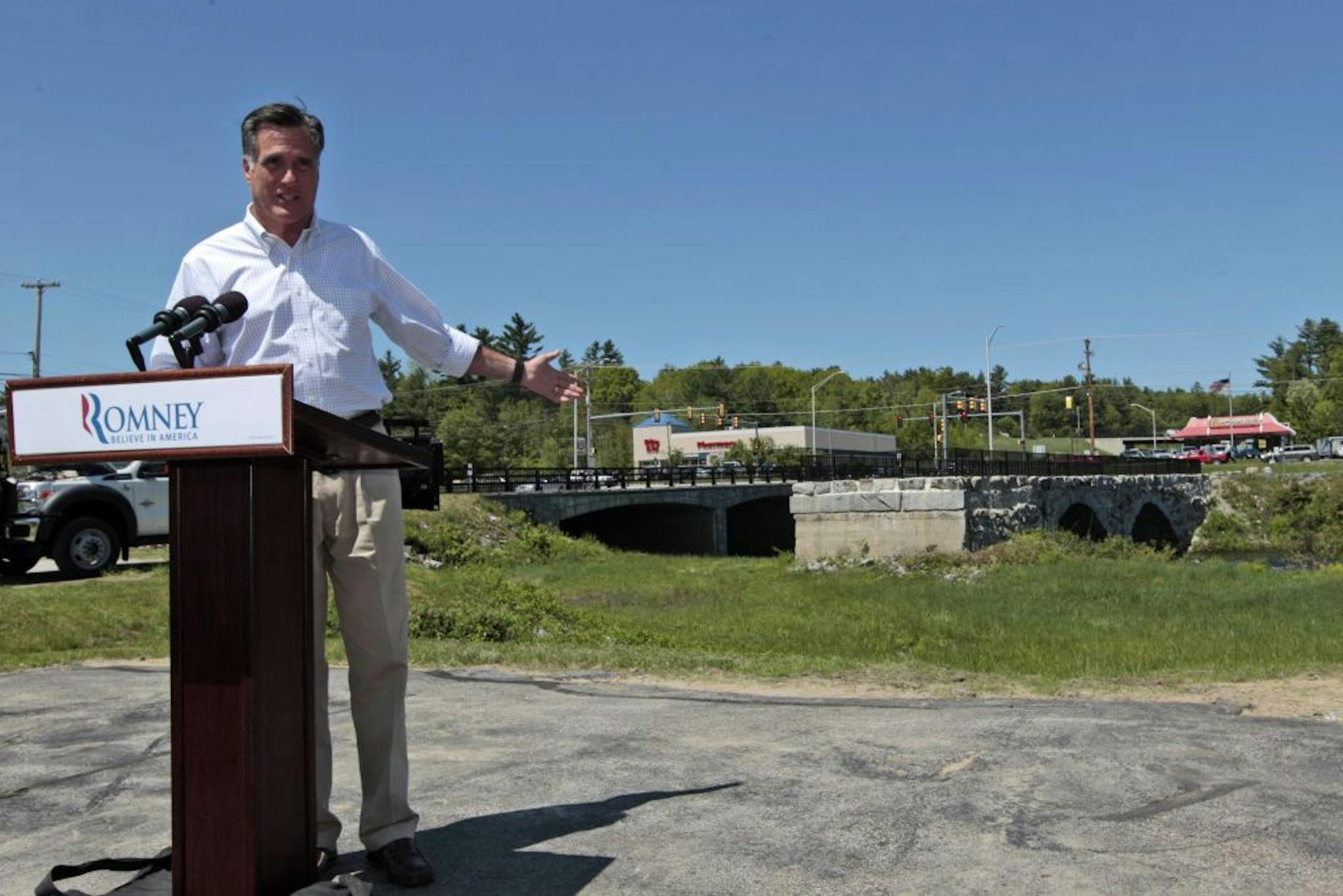 Republican presidential candidate, former Massachusetts Gov. Mitt Romney points at the Sawyer bridge as he speaks in Hillsborough, N.H., Friday, May 18, 2012.