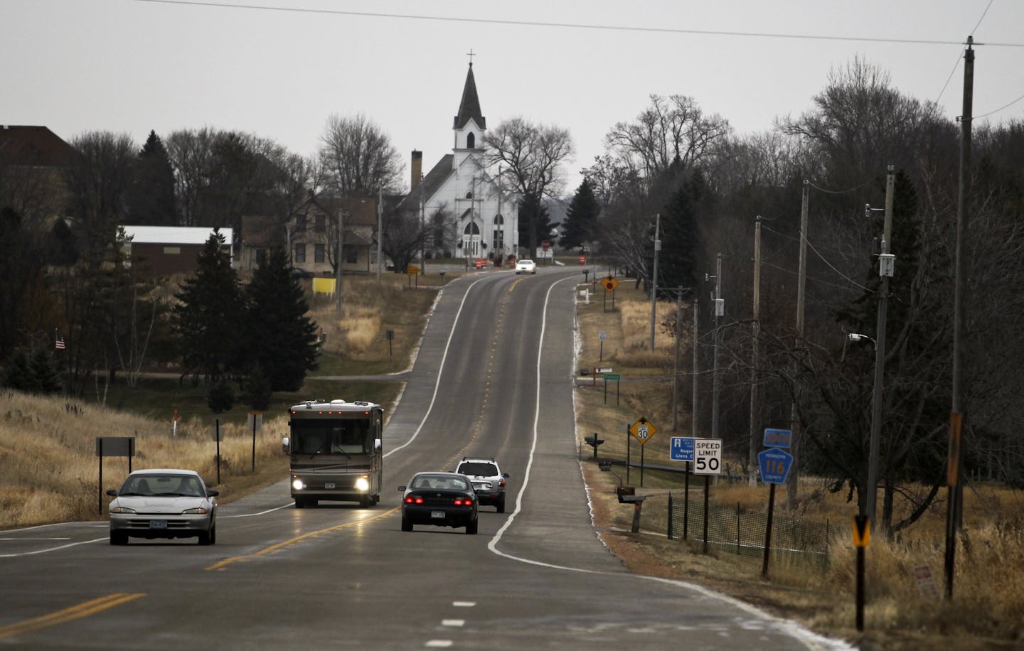 Traffic passed Mary Queen of Peace Catholic Church, background, on Territorial Road in Hassan Township earlier this month. Hassan Township, the last township in Hennepin County, will be annexed into the city of Rogers on Sunday.