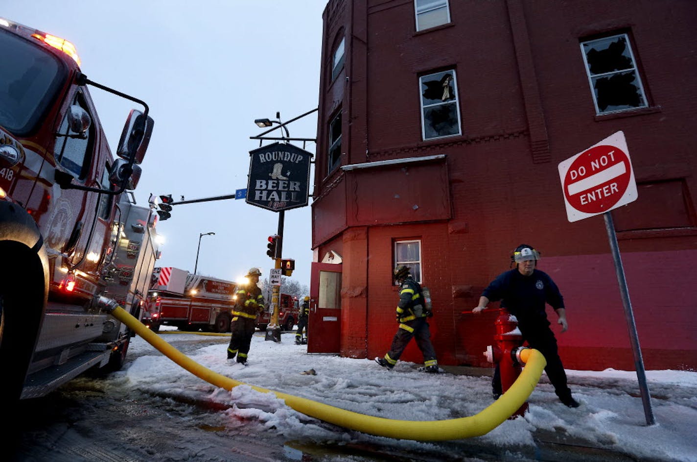 Firefighters at the scene of a fire on the 200 block of East Lake St. in Minneapolis on Sunday.