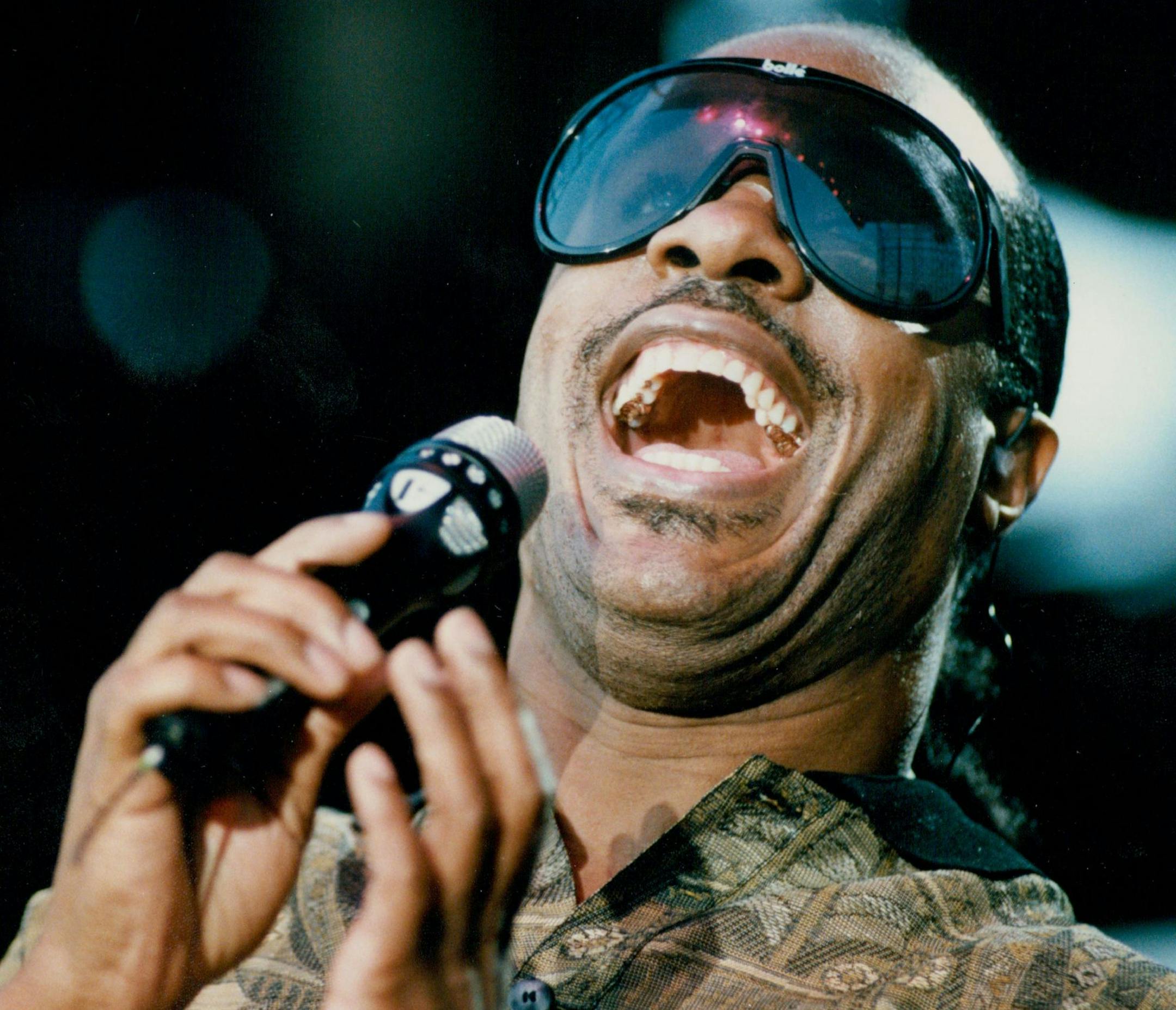 July 8, 1988 Rain, rainbows and Wonder music Motown recording artist Stevie Wonder helped open the 10-day River- Fest celebration on St. Haul's Harriet island Thursday night, offering hits that spanned his 25-year pop music career. Wonder even invited a woman from the audience to come onstage and sing. She brought the crowd off the benches with her loud, gospel-influenced improvising. She was so good that Wonder even jumped to his feet and clapped for her. Jon Bream review, page 2B. Brian Peters