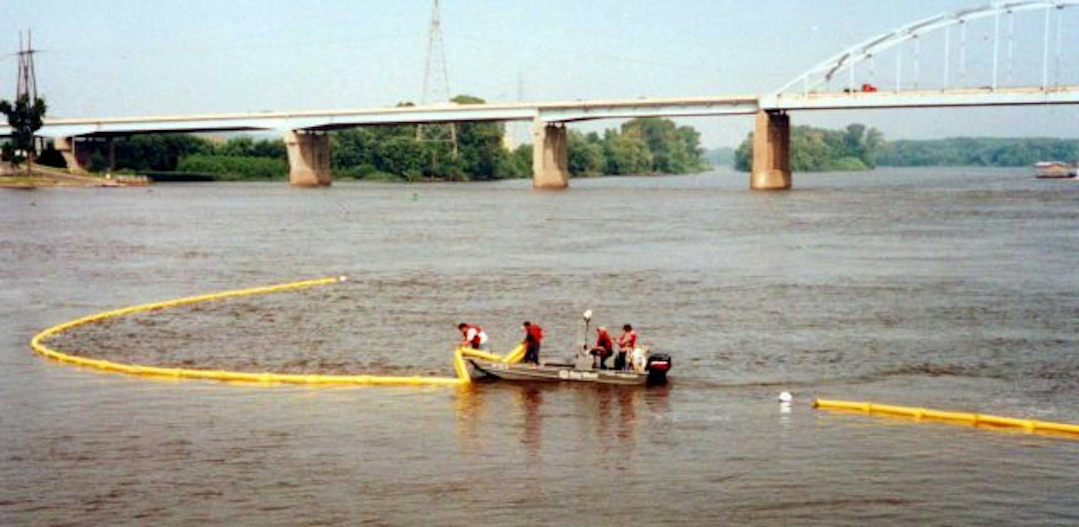 A Bay West crew deployed a containment boom during a training exercise on the Mississippi River. The company shipped similar booms to the Gulf Coast last week to help with the BP oil spill in the Gulf of Mexico.