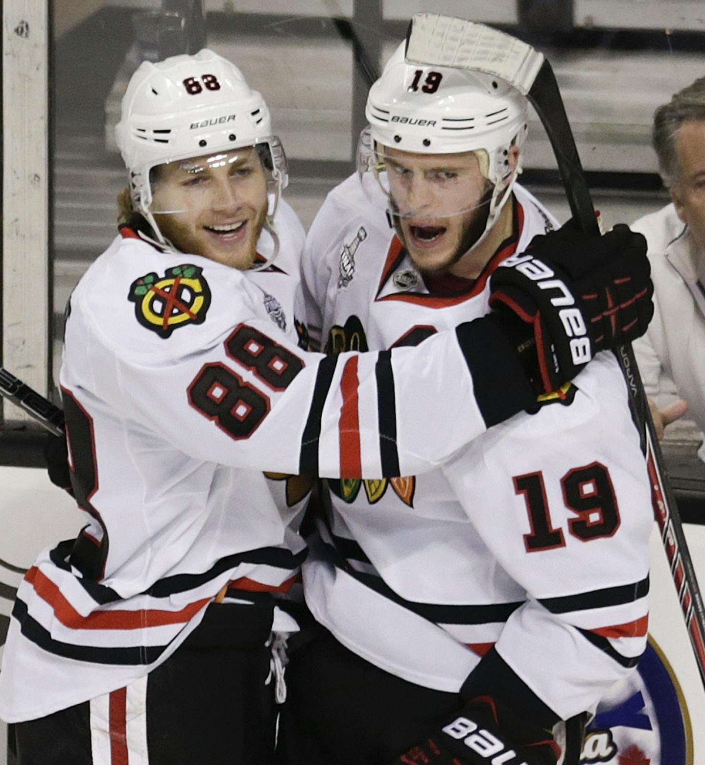 Chicago Blackhawks center Jonathan Toews (19) celebrates his goal with Blackhawks right wing Patrick Kane (88) during the second period in Game 4 of the NHL hockey Stanley Cup Finals against the Boston Bruins, Wednesday, June 19, 2013, in Boston. (AP Photo/Charles Krupa) ORG XMIT: BXG140