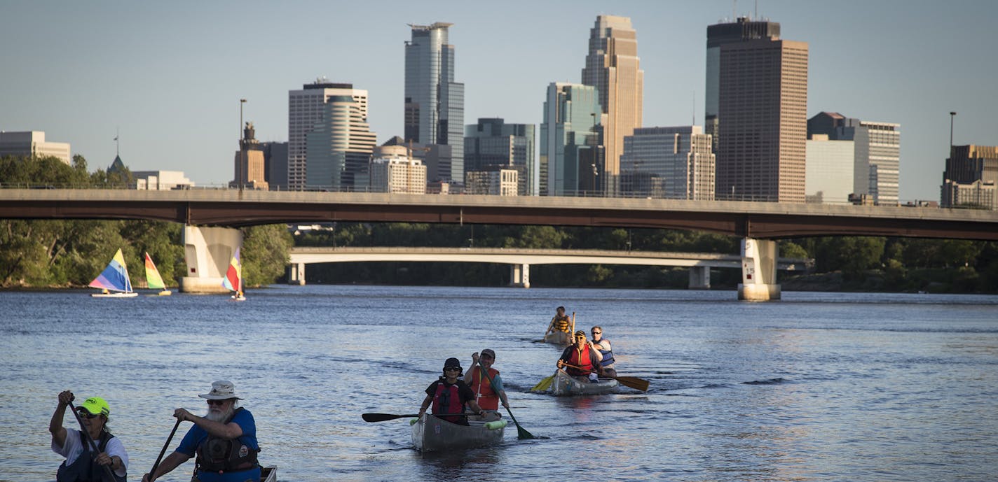 A line of canoes paddled past the audience during the during a rehearsal for the Mississippi River Boat Ballet on the Mississippi River in Minneapolis, Minn., on Wednesday, July 29, 2015. ] RENEE JONES SCHNEIDER &#x2022; reneejones@startribune.com ORG XMIT: MIN1507292312230224