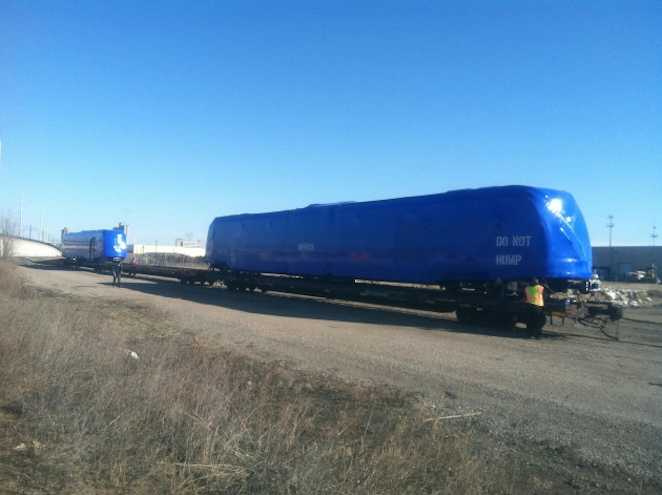 Two light rail cars, some shrinkwrap and a puzzling message.