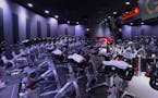 The CycleBar &#x201c;theater&#x201d; is decidedly upscale, with stadium-style seating and large-screen monitors.