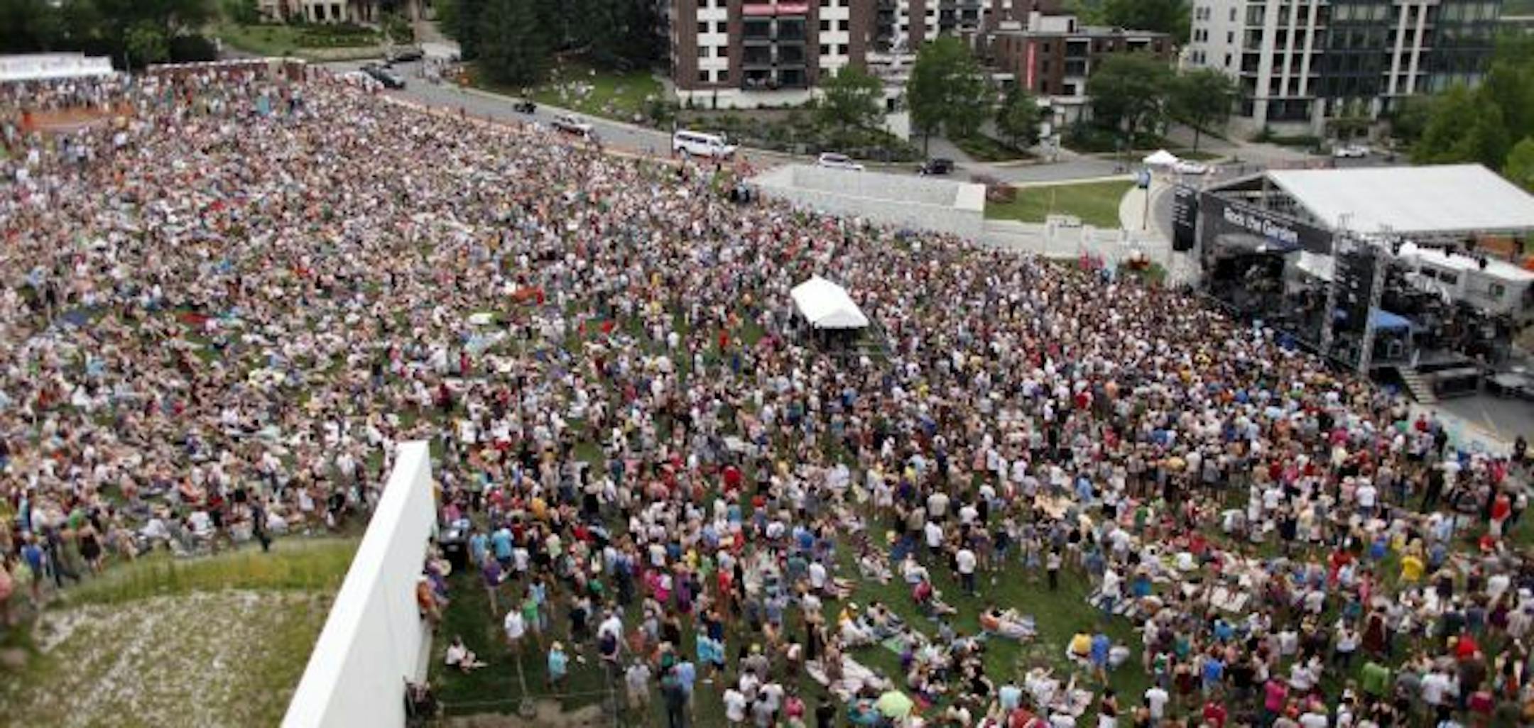 Crowds pack the Minneapolis Sculpture Garden as the band Yeasayer performs during the Rock the Garden concert Saturday afternoon at the Walker Art Center in Minneapolis.