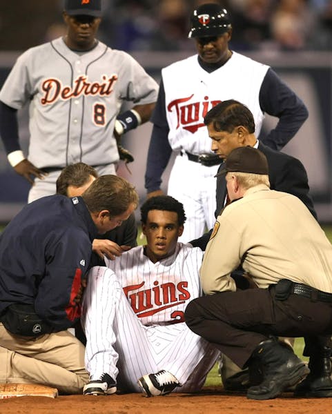 Carlos Gomez attended to Friday after getting hit in the head. He sat out Saturday's game.