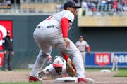 Willi Castro steals third base on a wild pitch as Red Sox third baseman Rafael Devers attempts the tag during the sixth inning Saturday.
