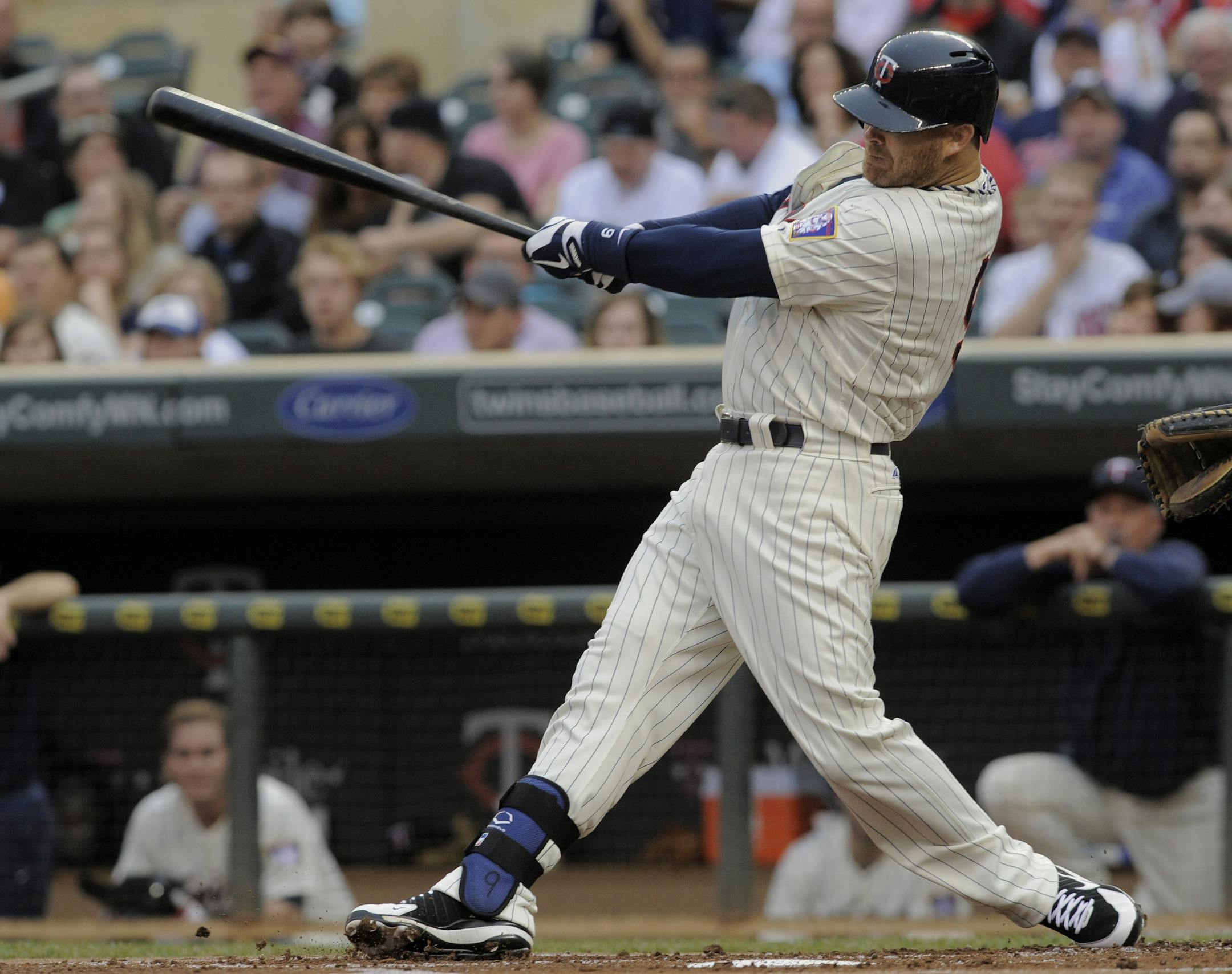 Ryan Doumit singles off Milwaukee Brewers pitcher Marco Estrada, driving in two runs, during the first inning