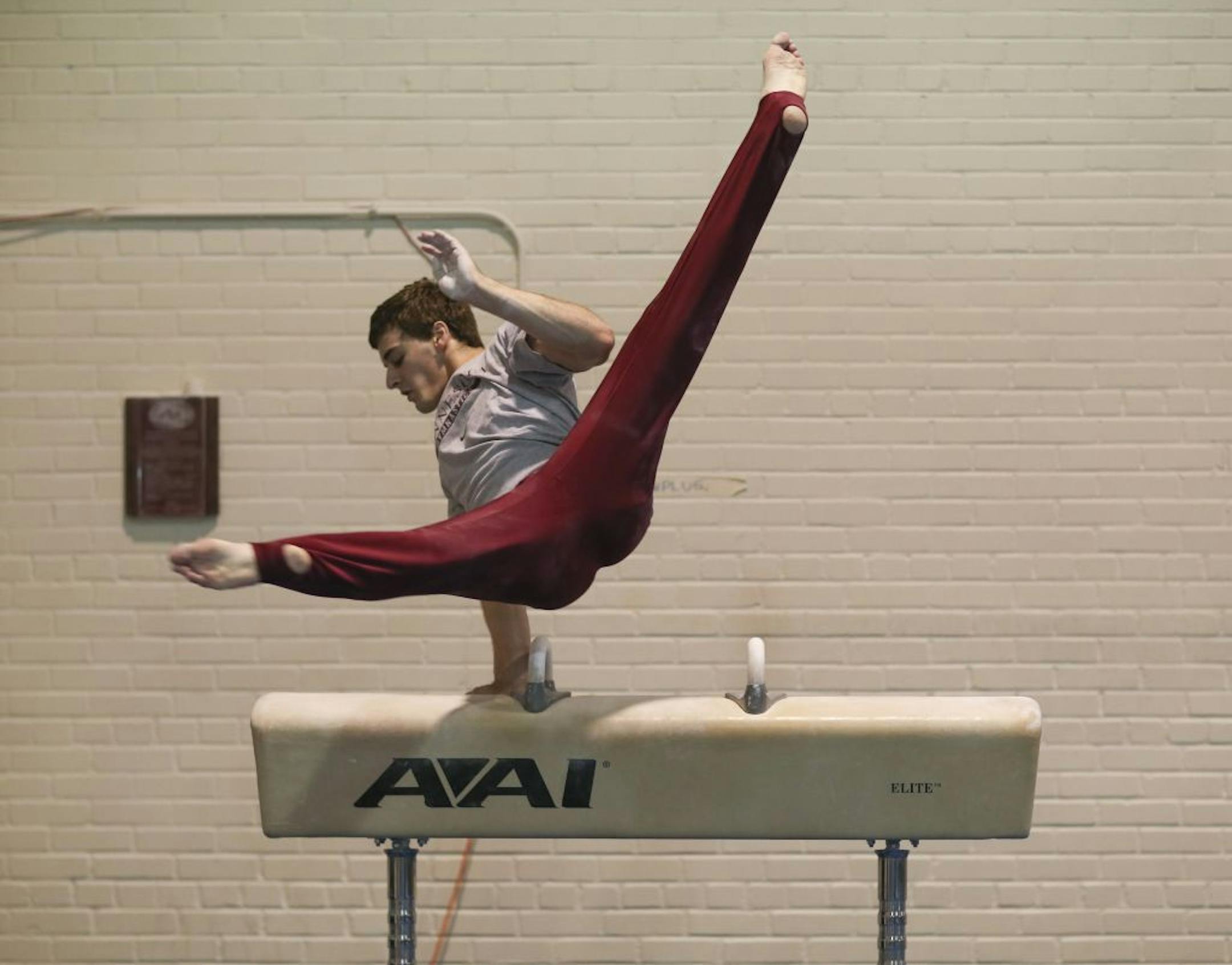 Gymnast Ellis Mannon practicing his routine on the pommel horse in the Cooke Hall gymnastics room Tuesday night. He's performing a skill that only he can do: a Direct Stockli "A" in flaired position.