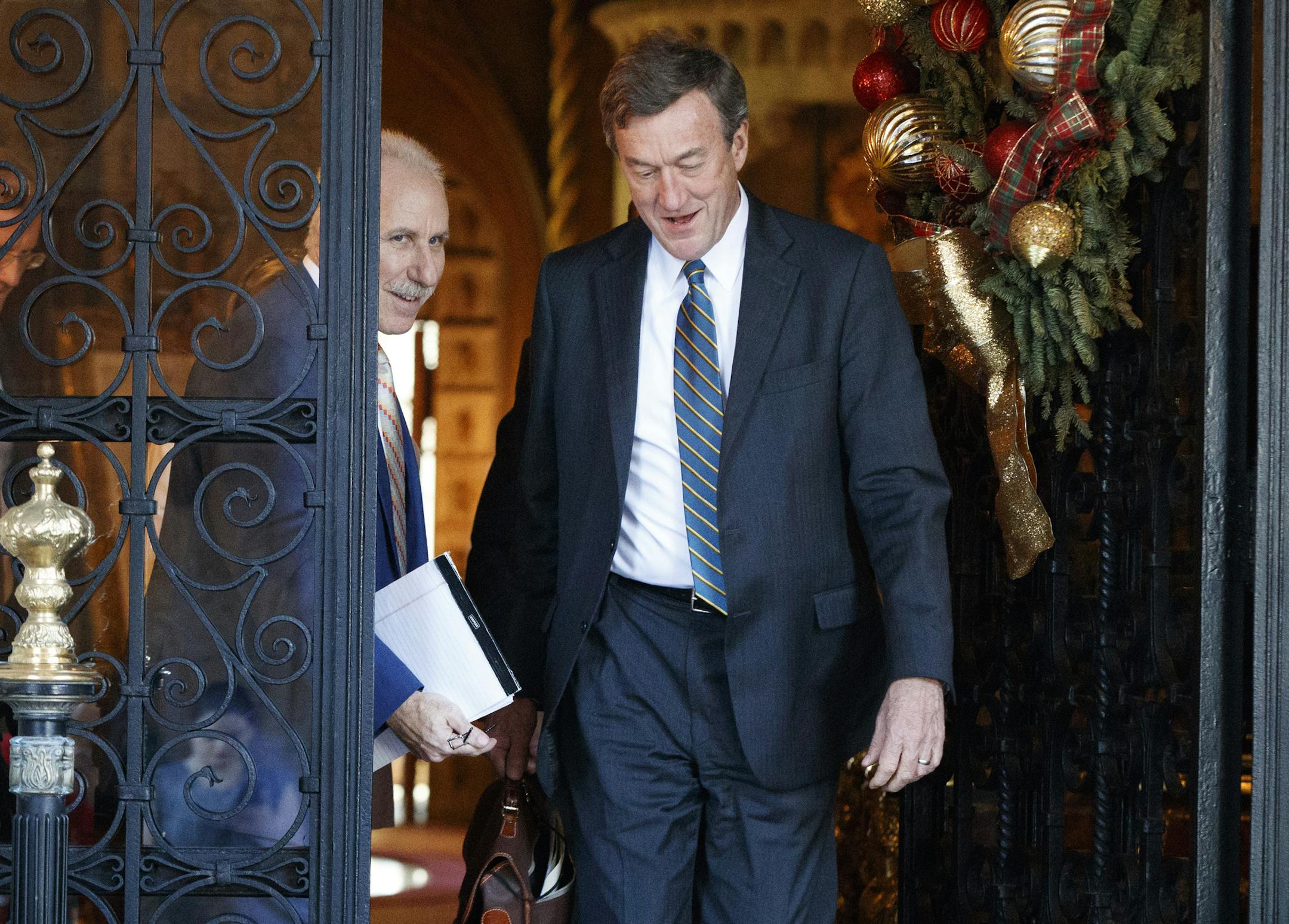 Johns Hopkins Medicine CEO Dr. Paul Rothman, left, and Mayo Clinic CEO John Noseworthy leave Mar-a-Lago after meeting with President-elect Donald Trump and his transition team, Wednesday, Dec. 28, 2016, in Palm Beach, Fla. (AP Photo/Evan Vucci)