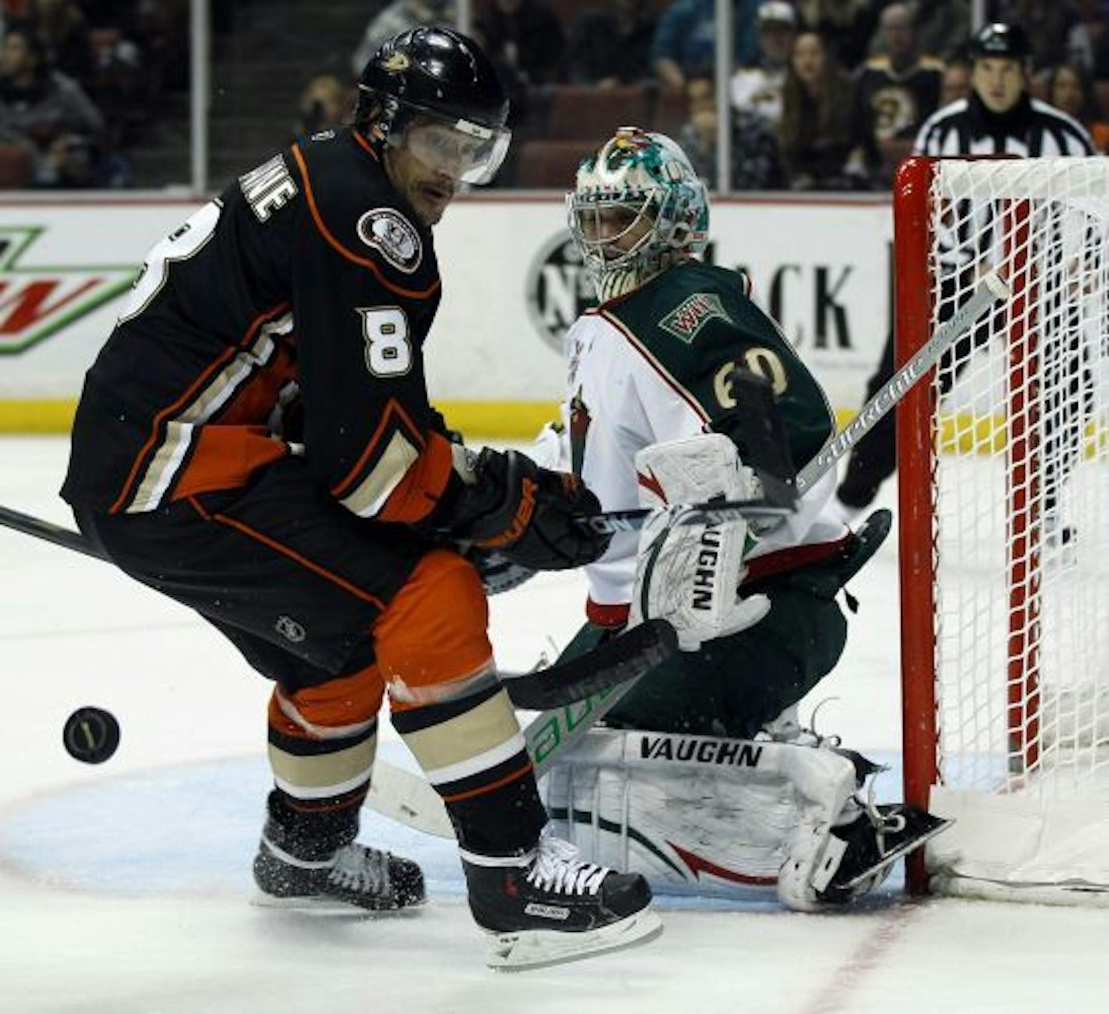 Minnesota Wild goalie Jose Theodore (60) stops a shot by Anaheim Ducks right wing Teemu Selanne (8), of Finland, in the second period of an NHL hockey game in Anaheim, Calif., Friday, Feb. 25, 2011.